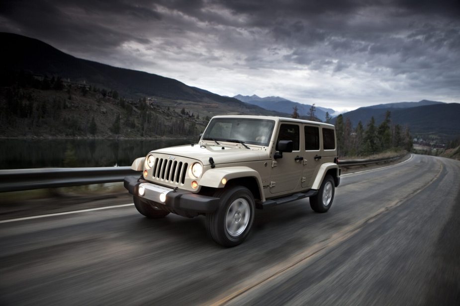 A champagne colored 2011 Jeep Wrangler