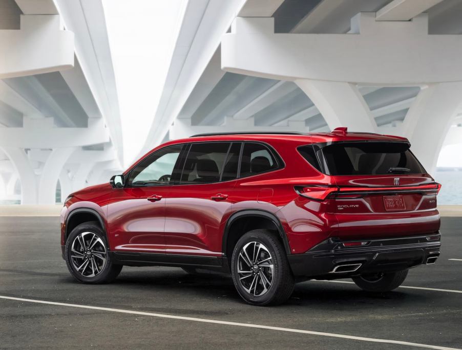 Red Buick Enclave SUV parked under a bridge