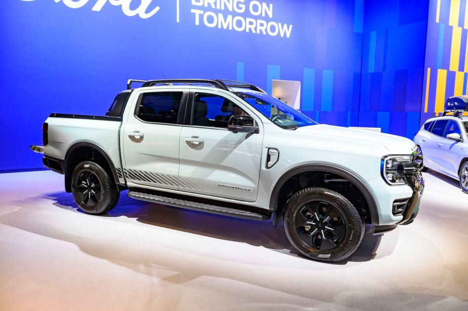 White Ford Ranger PHEV on stage at an auto show.