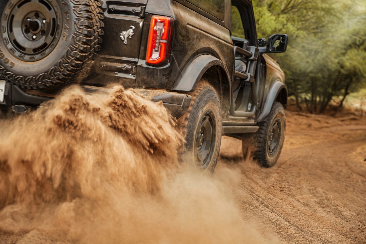 A 2025 Ford Bronco SUV off-roading in close right rear angle view