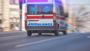Ambulance races through city to respond to fatal car crash.