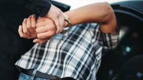 Police officers busted a Florida man with guns, drugs, and credit cars during a traffic stop.