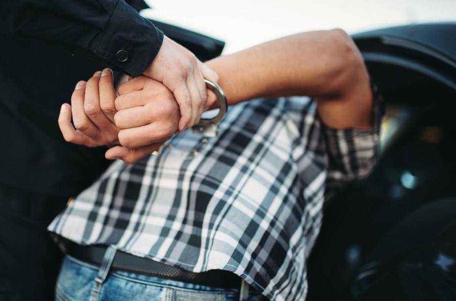 Police officers busted a Florida man with guns, drugs, and credit cars during a traffic stop.