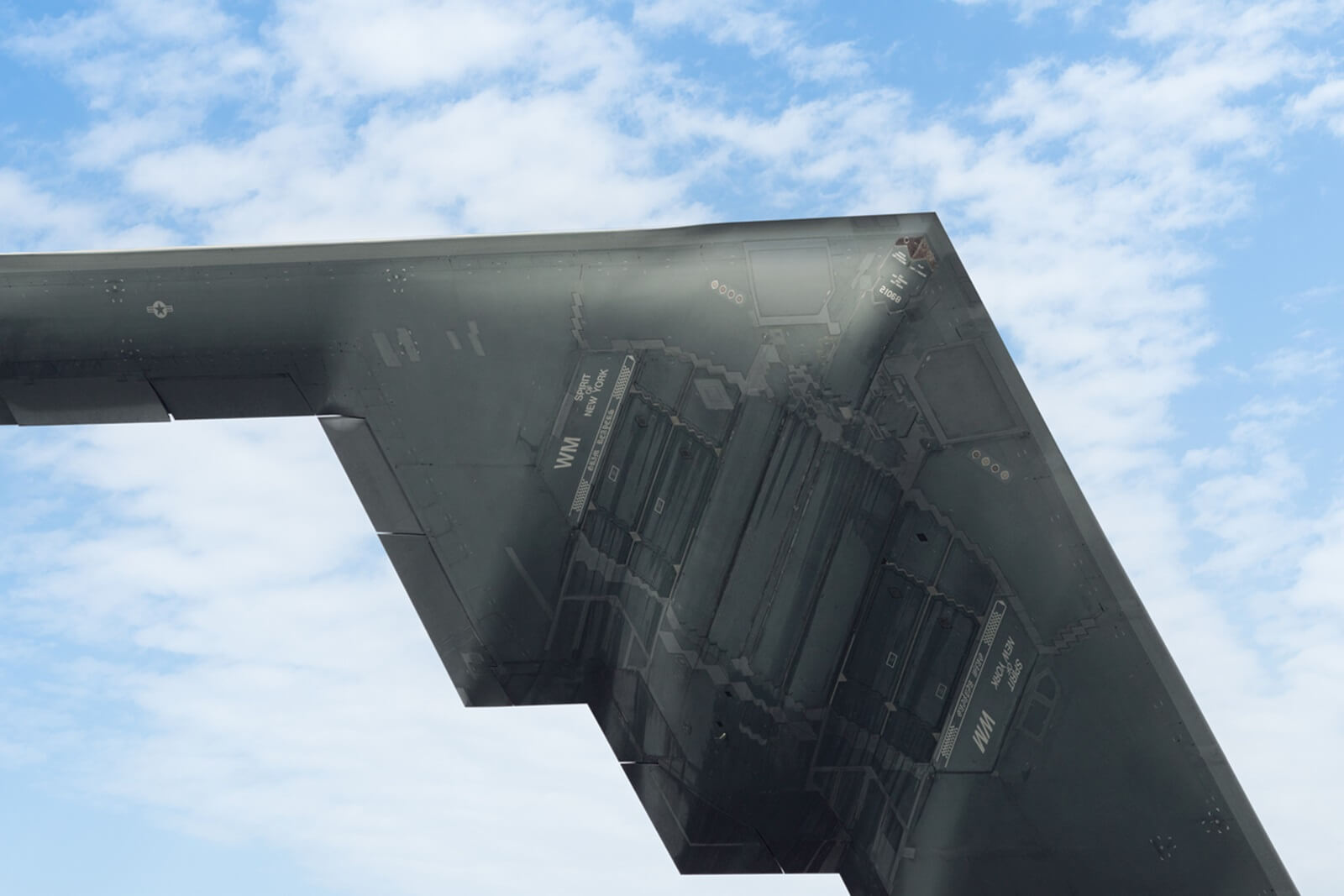 One of the United States' 19 known B-2 Stealth Bombers, the 'Spirit of New York,' as it flies overhead.