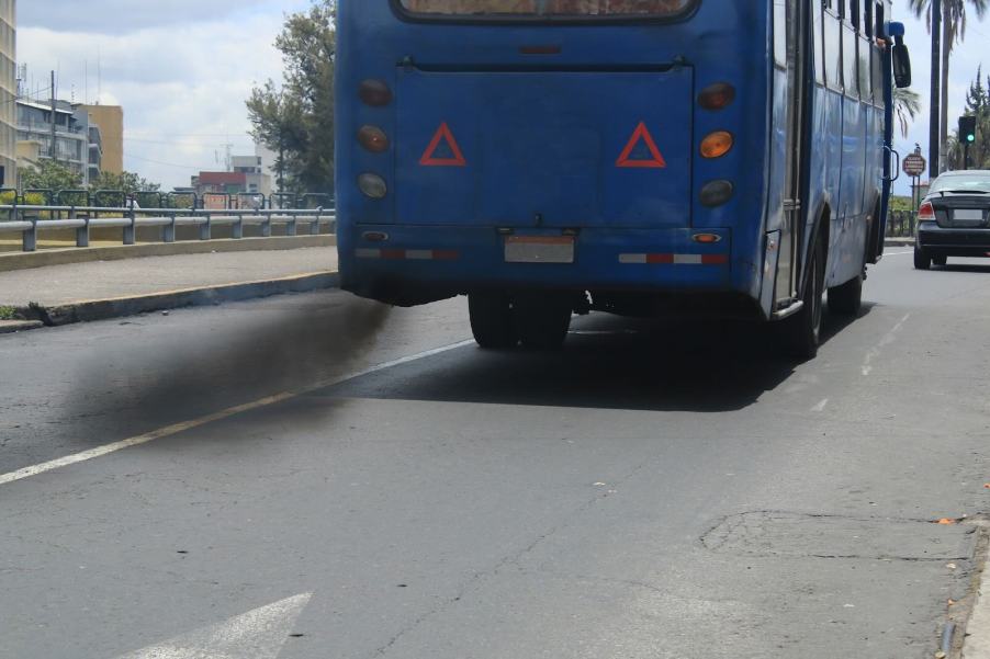 Black exhaust fumes pouring from the tailpipe of a bus in New Hampshire