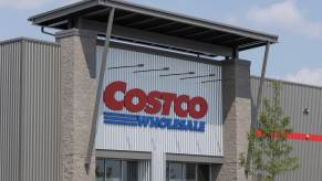 The Costco sign above a store, the front doors visible.
