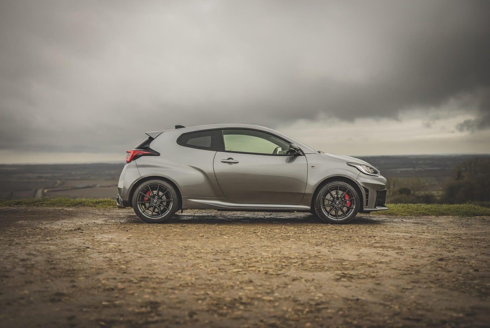A Toyota GR Yaris hot hatchback from the side.