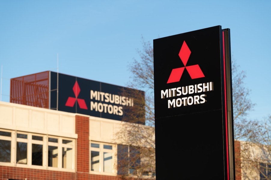 Mitsubishi motors logo on a black sign outside the automaker's headquarters during an Outlander SUV recall.