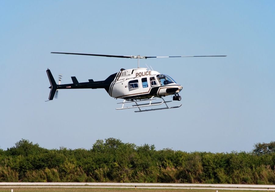 A police helicopter aids units during a chase.