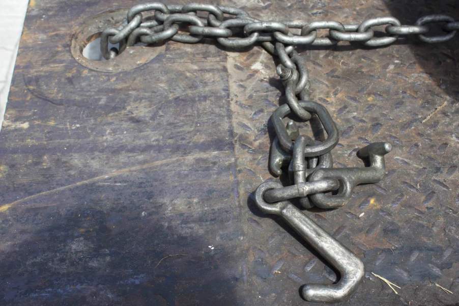 Chain hook on an empty rollback truck after a man climbed on to re-repossess his Ford SUV