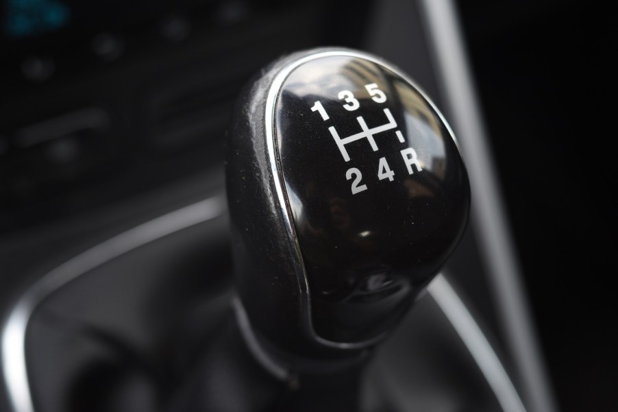 The gear indicators on the shift knob of a manual transmission.