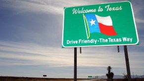 Welcome to Texas sign on the highway.
