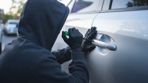 Thief forces open a stolen car lock