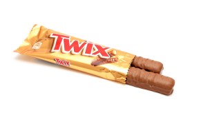 Unwrapped double Twix bar on a white background.