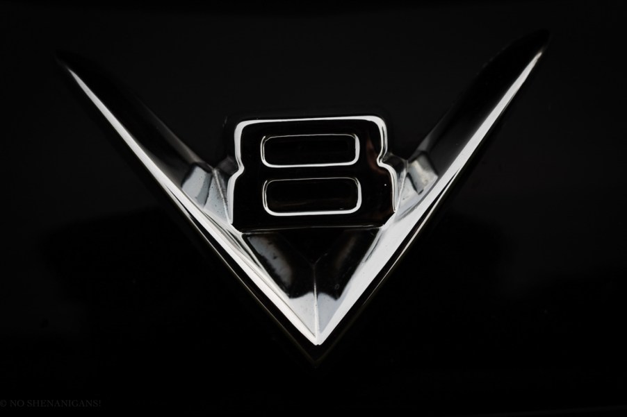 Chrome logo on the hood of a black, V8, half-ton pickup truck