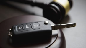 A gavel and car key fob depicting a DUI conviction