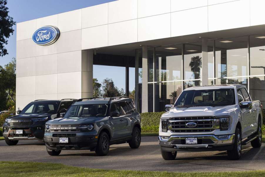 A Ford dealership exterior, Ford recently paused Explorer production citing a shortage of magnets from China
