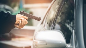 Gun pointed at car in jugging attack.
