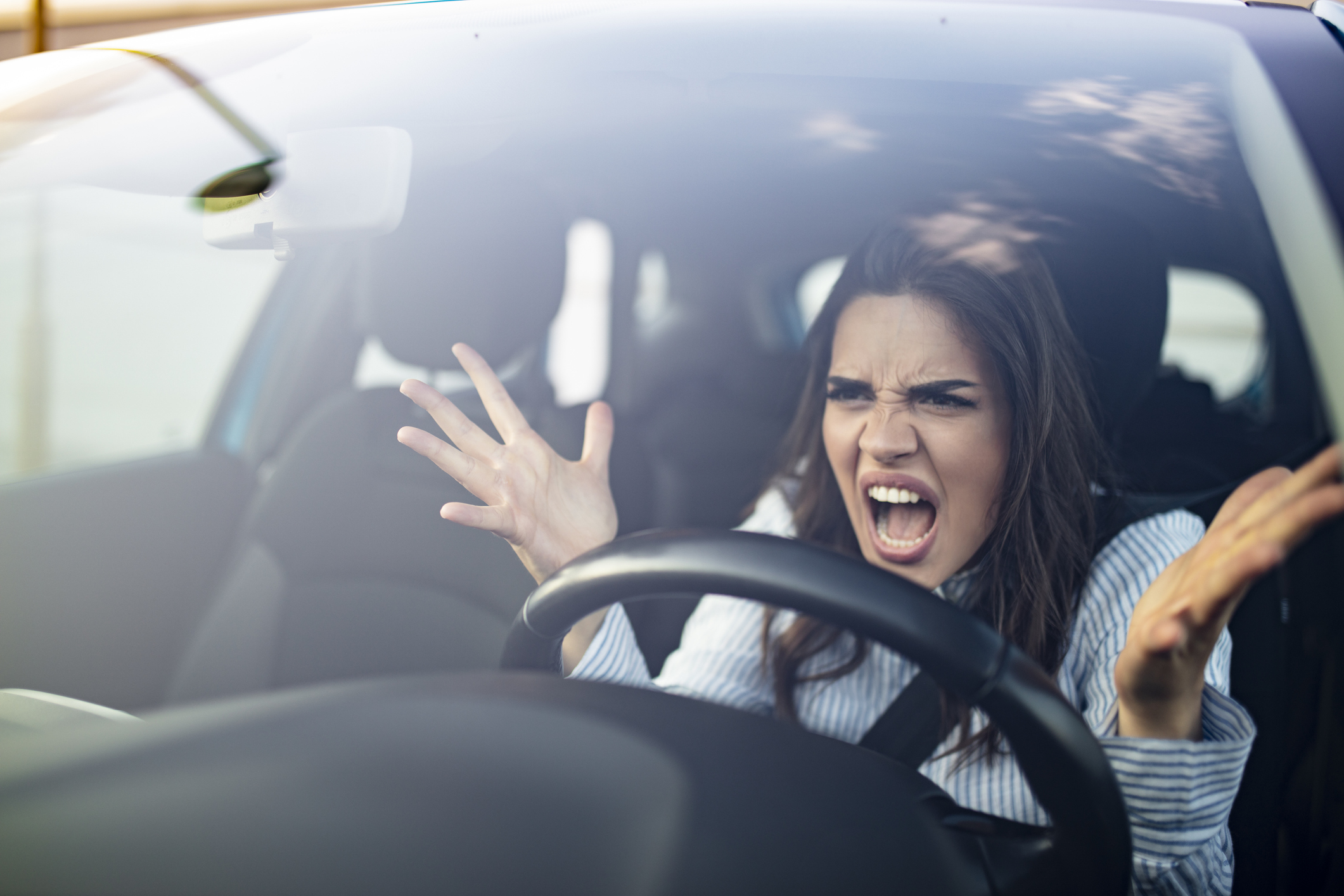 An angry woman in a car