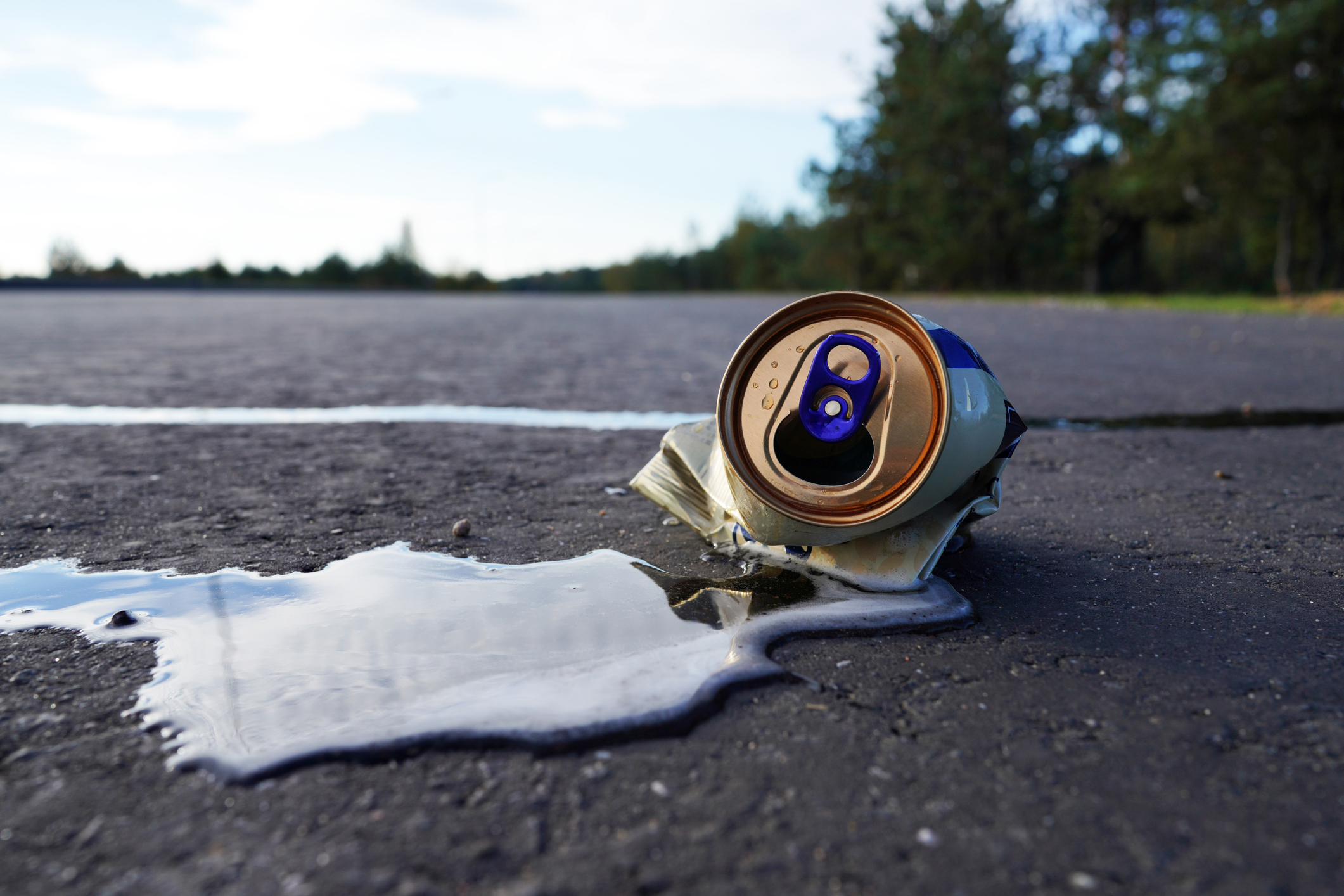 A beer can on the road