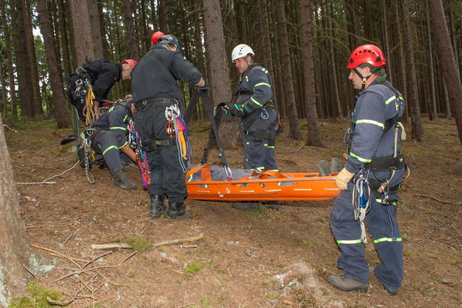 Rescue teams extracting a person from a cliff