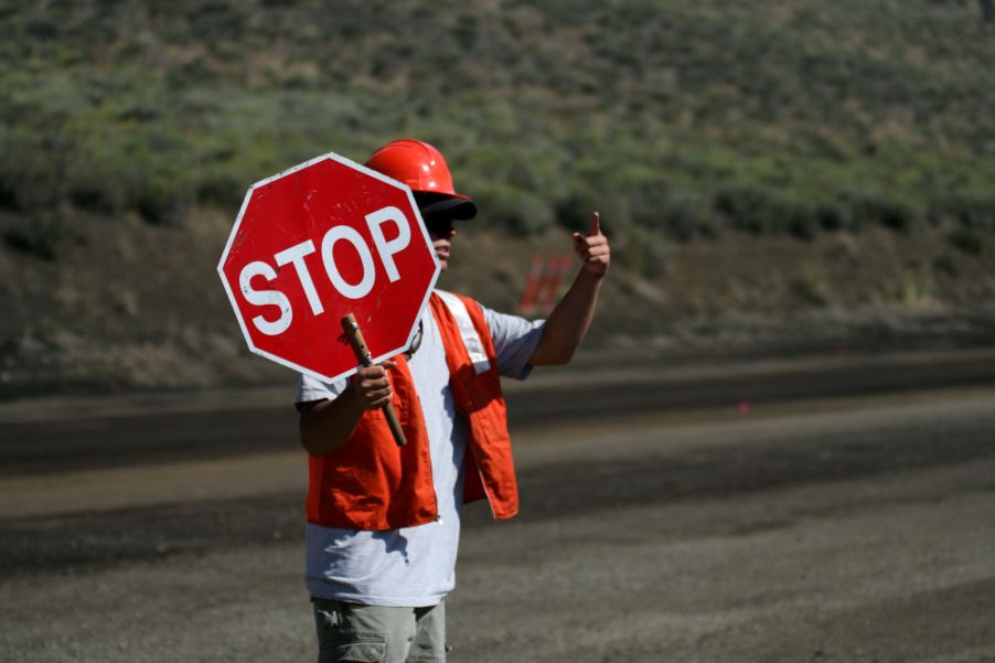 Road worker holding a Stop sign