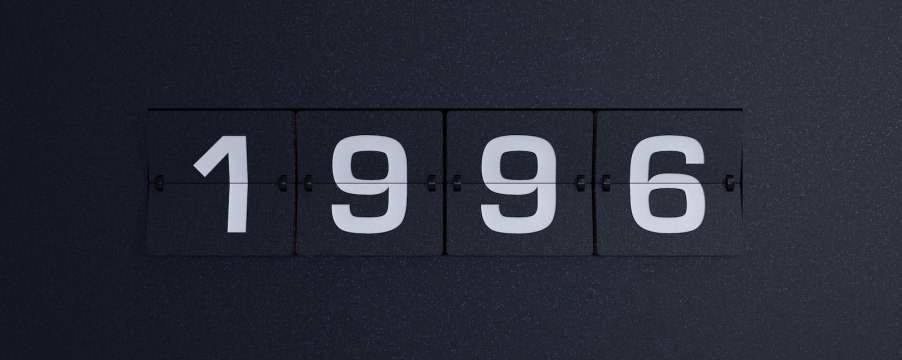 Alarm clock flipboard that reads "1996" over a black background.