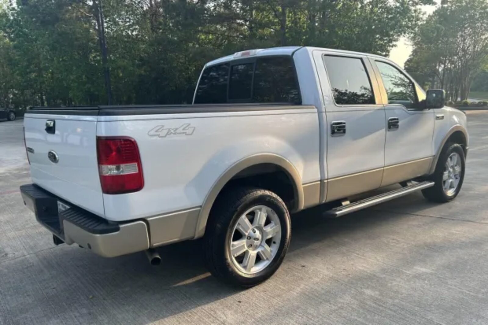 A white 2008 Ford F-150 parked in right rear angle view