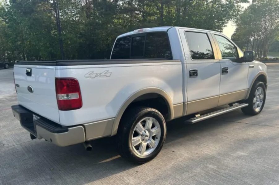 A white 2008 Ford F-150 parked in right rear angle view