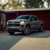 The 2025 Chevy Silverado near a home