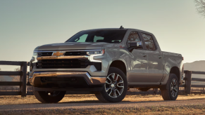 The 2025 Chevy Silverado 1500 near a fence