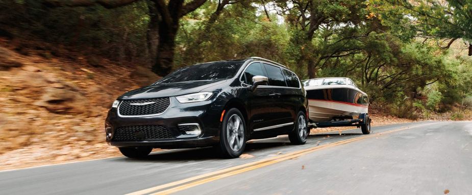 The 2025 Chrysler Pacifica towing a boat