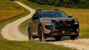 The 2025 Nissan Rogue on a dirt road