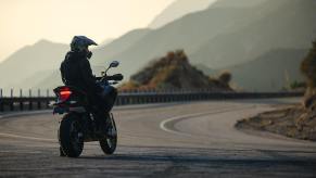 A 2025 Zero DSR EV motorcycle parked alongside canyon corners in California.