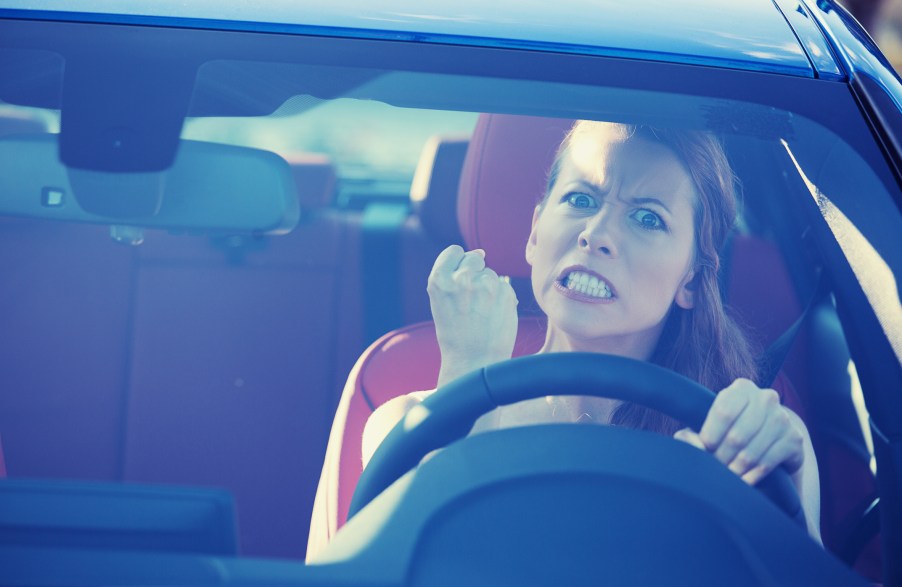 An angry woman driving an SUV