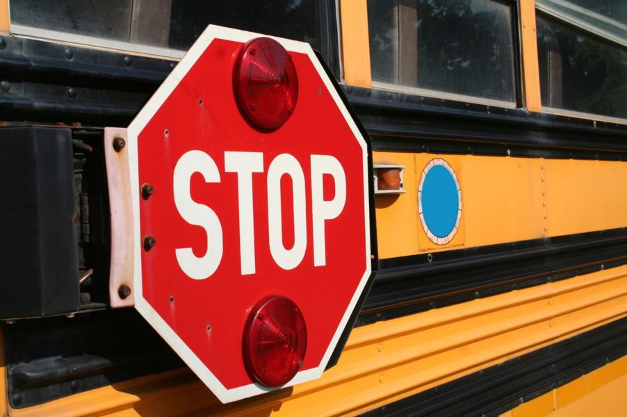 A stop sign on a school bus is a reminder for drivers to halt and allow children to offload and load the bus.