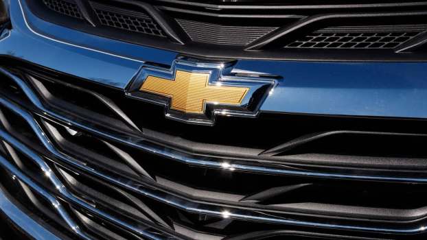 Yellow bowtie on a blue Chevrolet crossover grille.