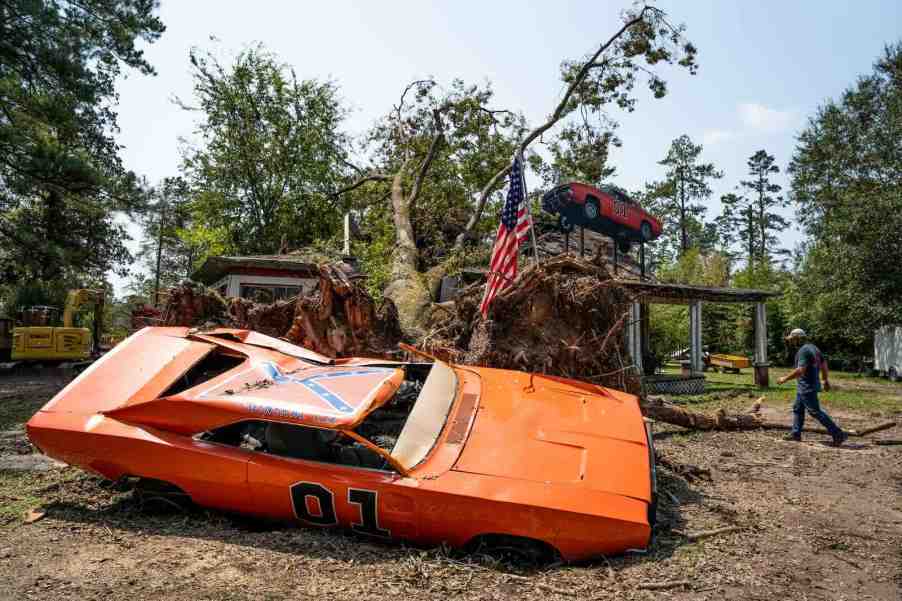 Crushed Dodge Charger General Lee replica sits in a field