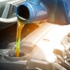 Pouring oil into an engine during a change.