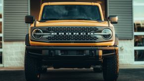 A yellow Ford Bronco shows off its fascia.