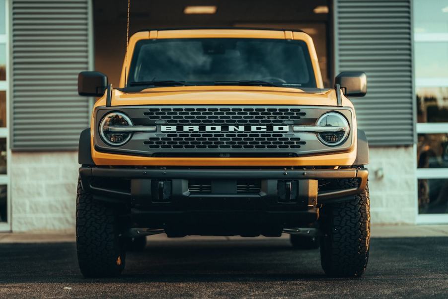 A yellow Ford Bronco shows off its fascia.