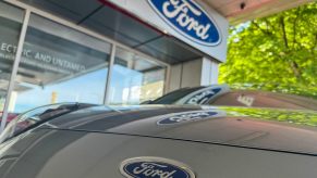 Logo on a recalled Ford crossover parked at a dealership.