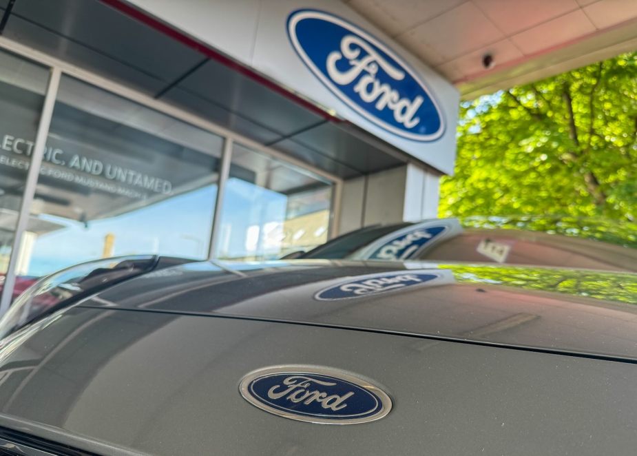 Logo on a recalled Ford crossover parked at a dealership.