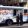 An ice cream truck in the city