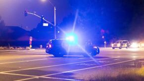 A police SUV at an intersection like the ones responding to a vehicular homicide wherein a Florida woman hit and dragged a motorcycle rider.