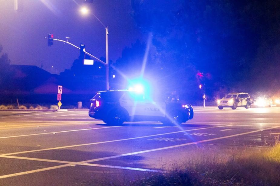A police SUV at an intersection like the ones responding to a vehicular homicide wherein a Florida woman hit and dragged a motorcycle rider.