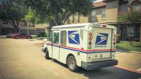 United States Postal Service USPS mail truck parked in a residential neighborhood