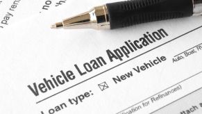 A car loan application and pen in very close view