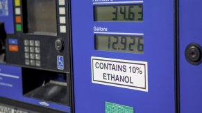 A sign reading "Contains up to 10% ethanol" on a gas pump