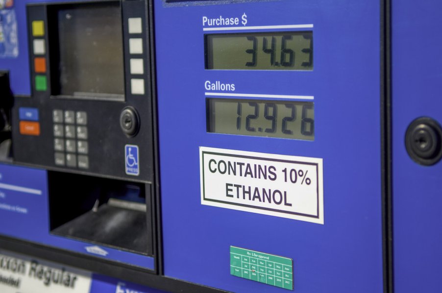 A sign reading "Contains up to 10% ethanol" on a gas pump